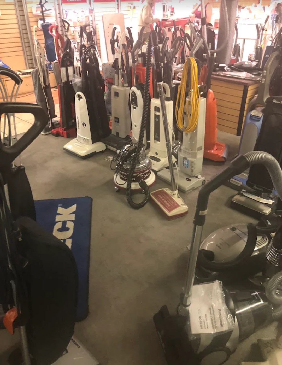 Vacuum cleaners lined up on the showroom floor